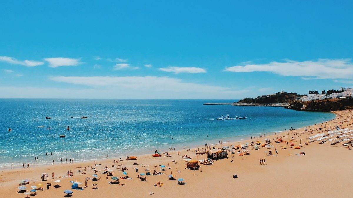 A wide Algarve beach and bright blue sea